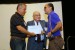 Dr. Nagib Callaos, General Chair, congratulating Eng. Carlos A. Meneses and Eng. Saulo Torres for winning the best paper award of the session "Sistemas / Tecnologías de la Información y Globalización Académica". The title of the awarded paper is "Ajedrez con Accesibilidad y Autonomía para Personas en Situación de Discapacidad Visual."